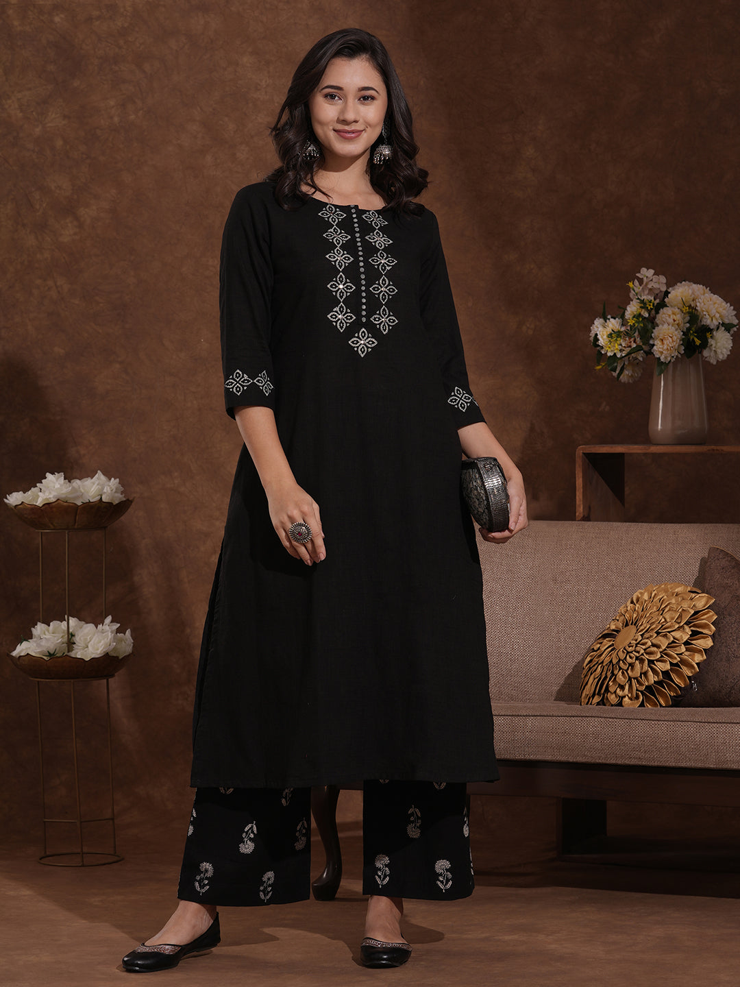 A-line kurta with block printed front and sleeves paired with printed palazzos.