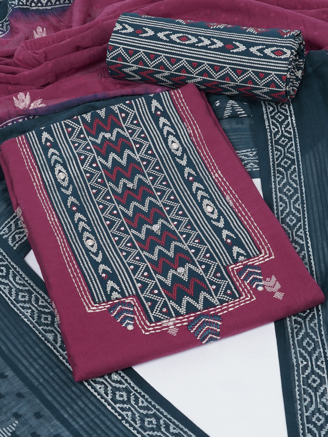 3-piece unstitched suit set featuring a butti-printed kurta with coordinated yoke detailing.