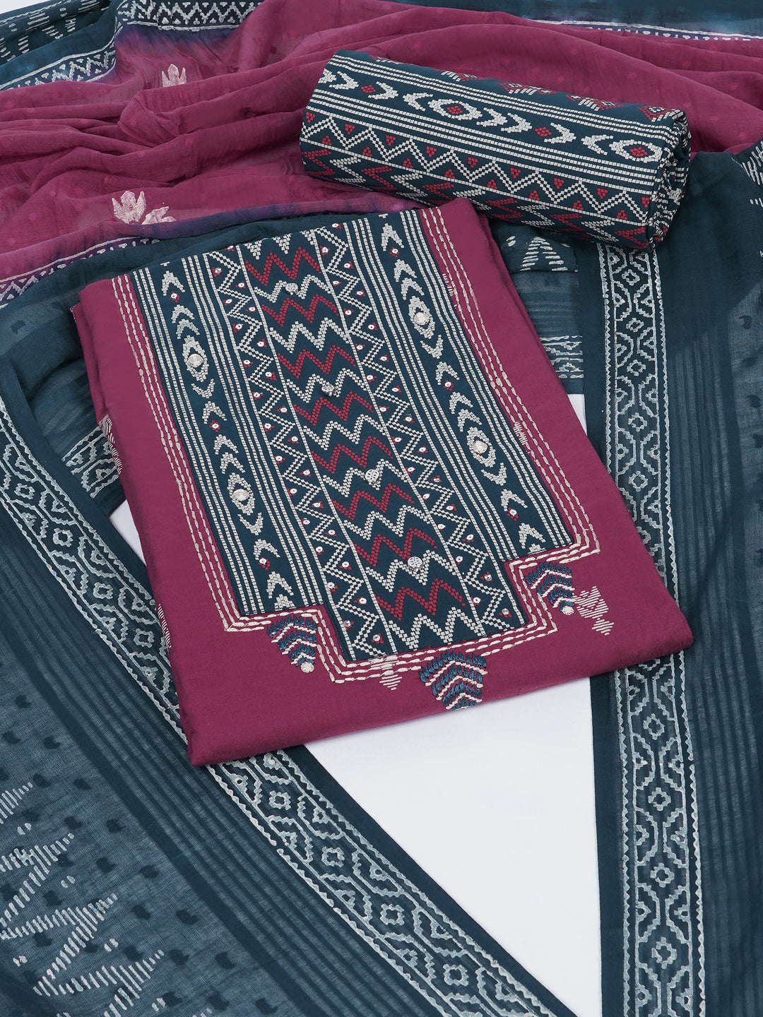 3-piece unstitched suit set featuring a butti-printed kurta with coordinated yoke detailing.