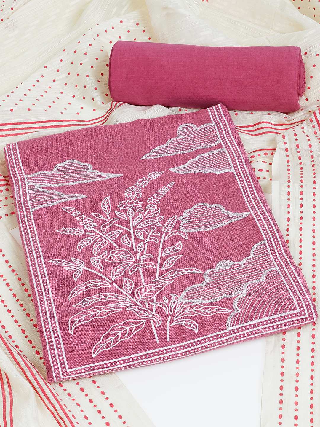Unstitched suit set features a solid kurta adorned with a block-printed yoke and intricate embroidery details.(Pink)