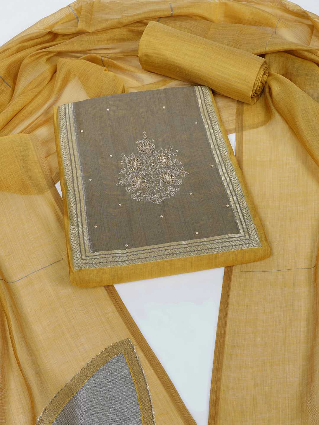 Unstitched suit set in elegant tussar silk featuring a contrast blue yoke with delicate zari work.(Yellow)