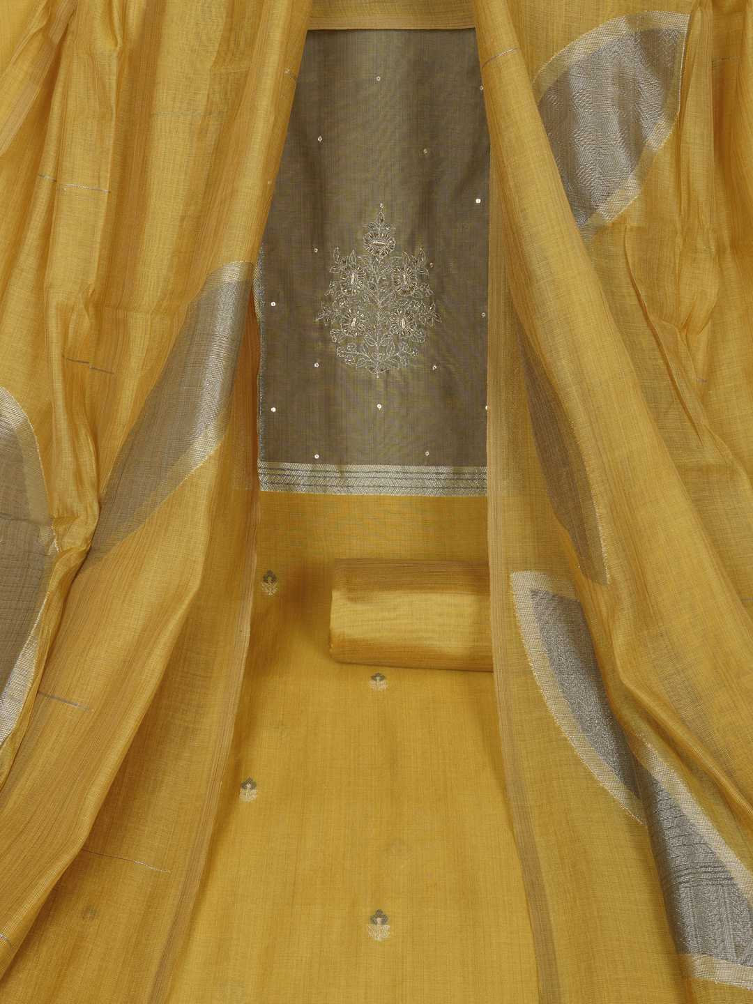Unstitched suit set in elegant tussar silk featuring a contrast blue yoke with delicate zari work.(Yellow)