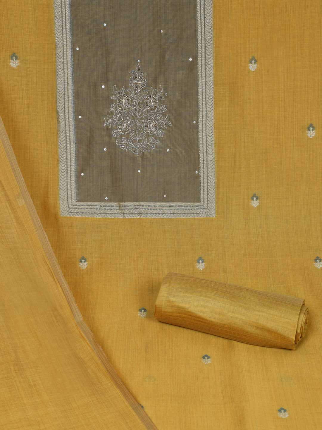 Unstitched suit set in elegant tussar silk featuring a contrast blue yoke with delicate zari work.(Yellow)