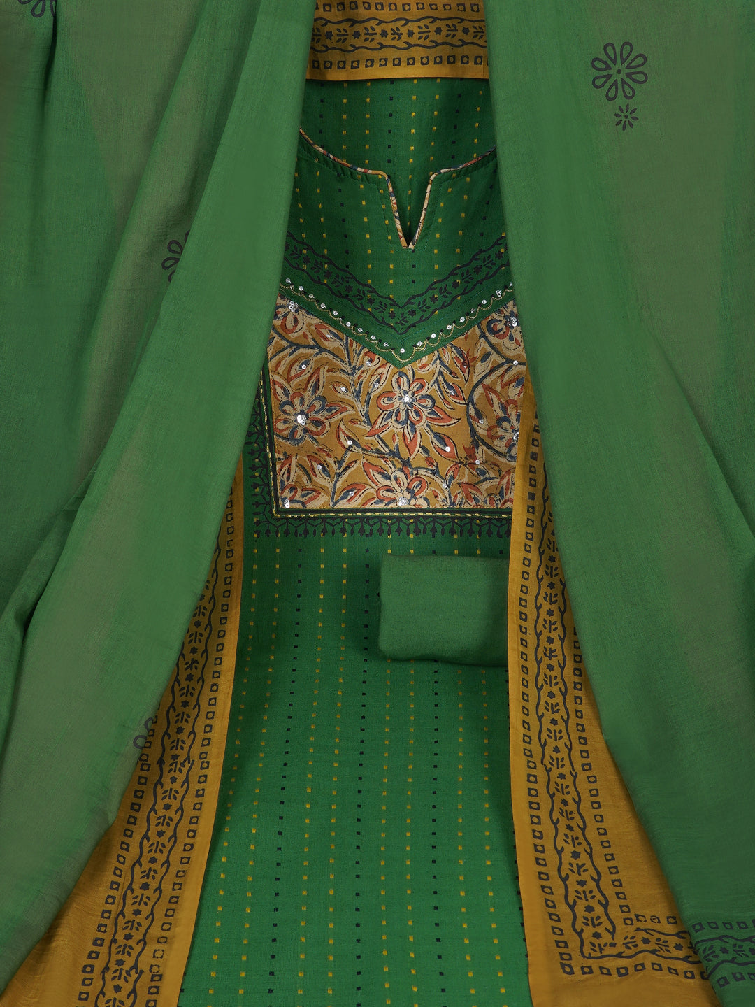 Unstitched suit set crafted in dobby fabric features a handcrafted Kalamkari printed patch.