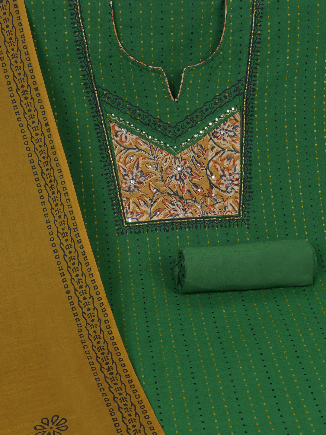 Unstitched suit set crafted in dobby fabric features a handcrafted Kalamkari printed patch.