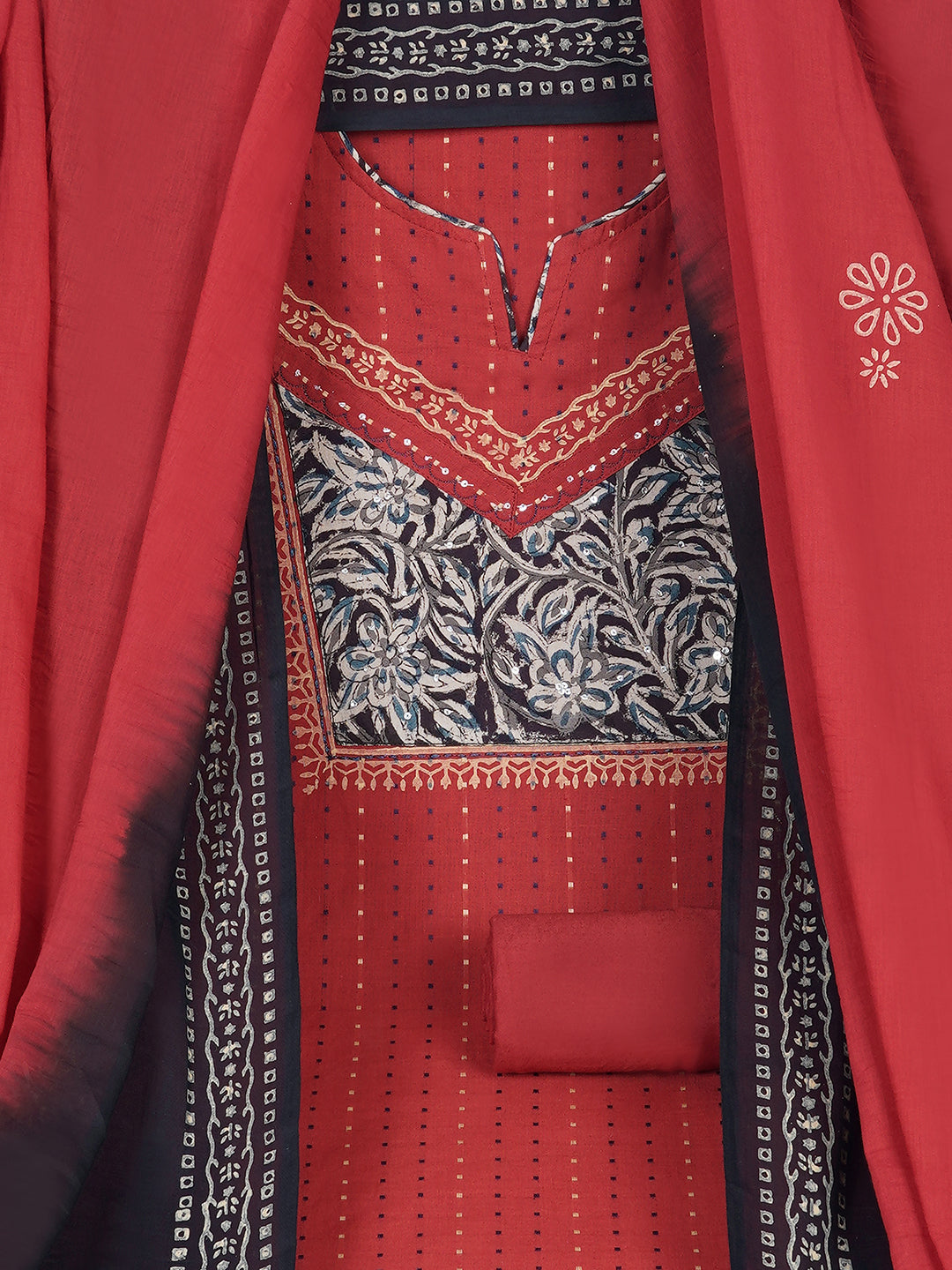 Unstitched suit set crafted in dobby fabric features a handcrafted Kalamkari printed patch.