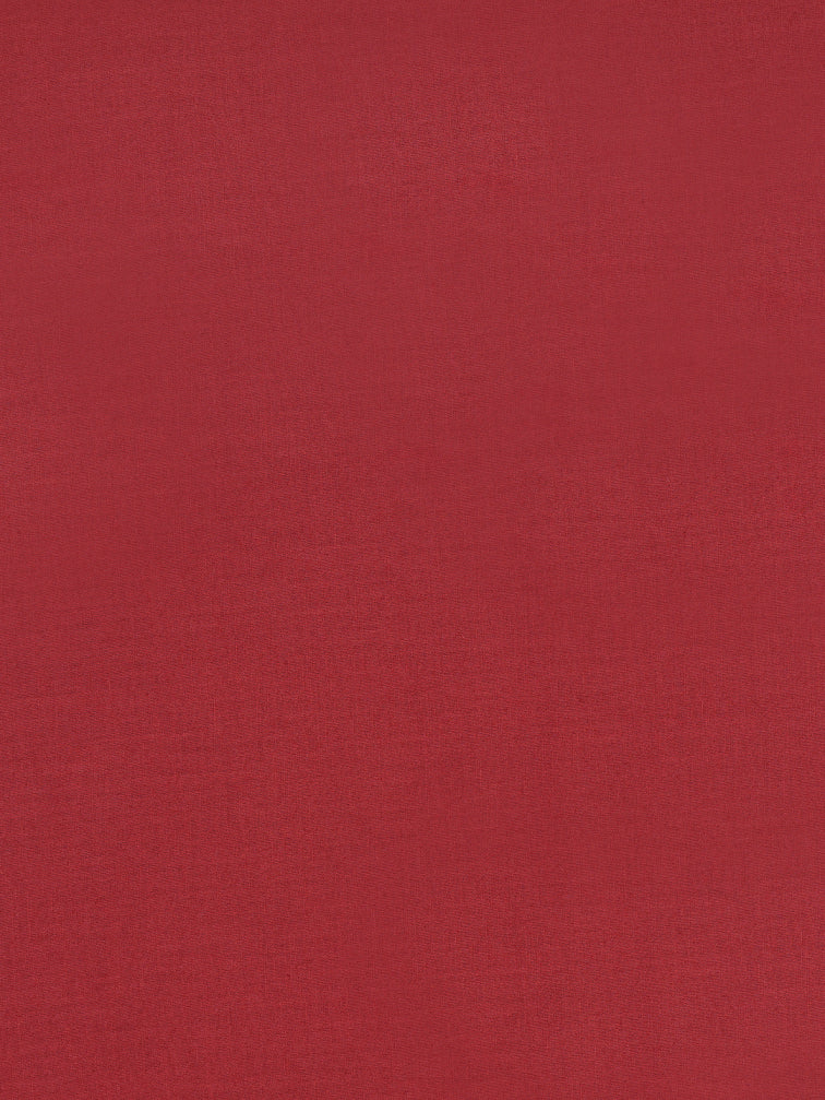 Unstitched suit set crafted in dobby fabric features a handcrafted Kalamkari printed patch.