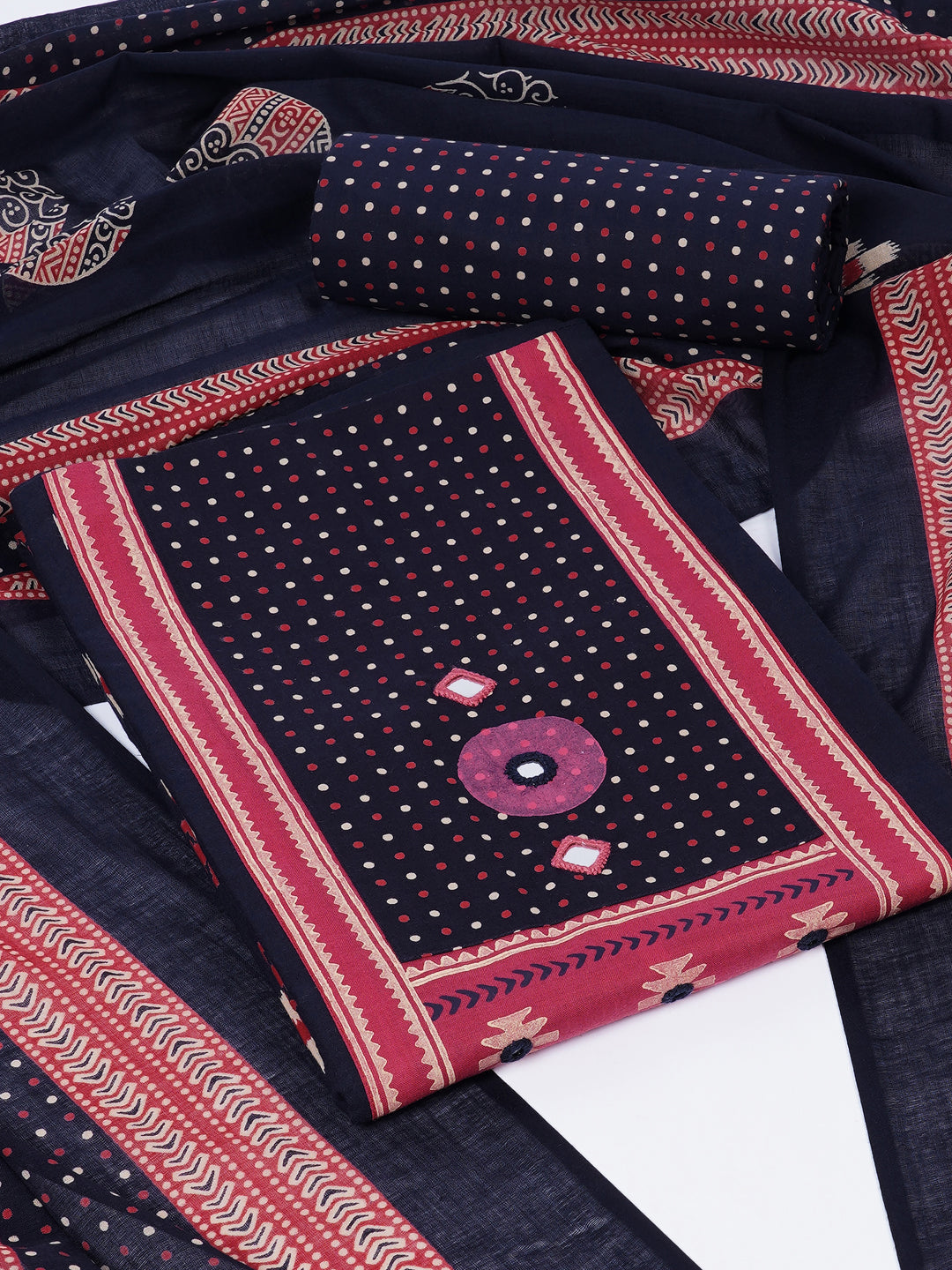 Unstitched suit set featuring a contrast yoke crafted in block print fabric and delicate handwork.