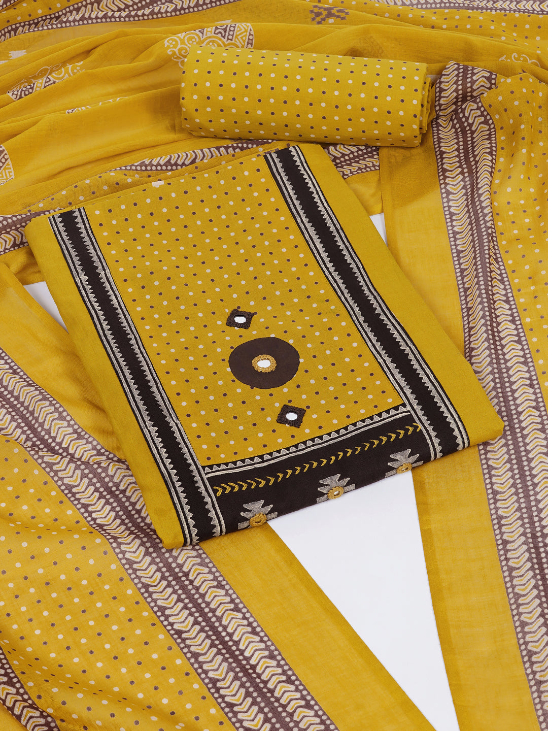 Unstitched suit set featuring a contrast yoke crafted in block print fabric and delicate handwork.