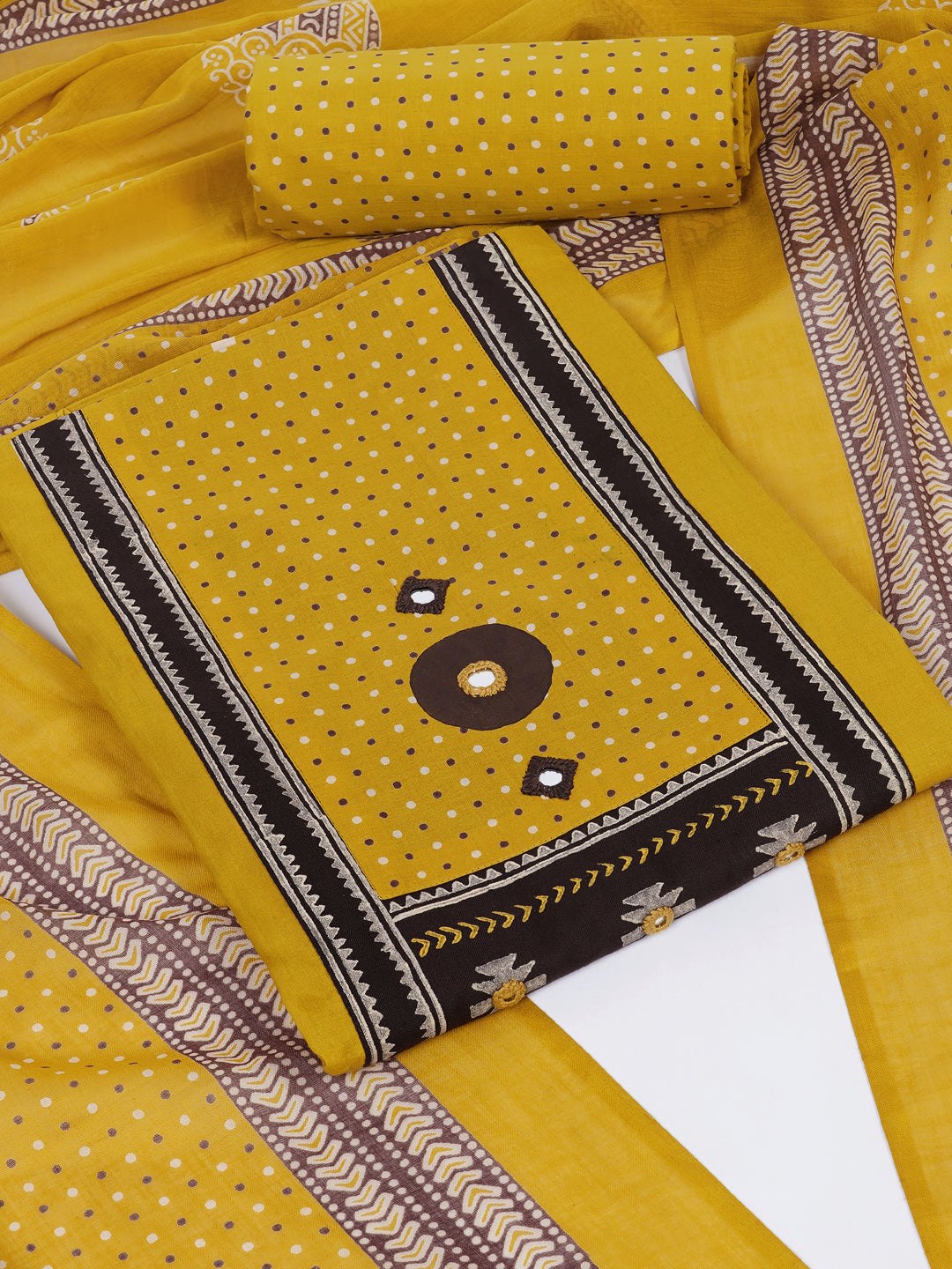 Unstitched suit set featuring a contrast yoke crafted in block print fabric and delicate handwork.