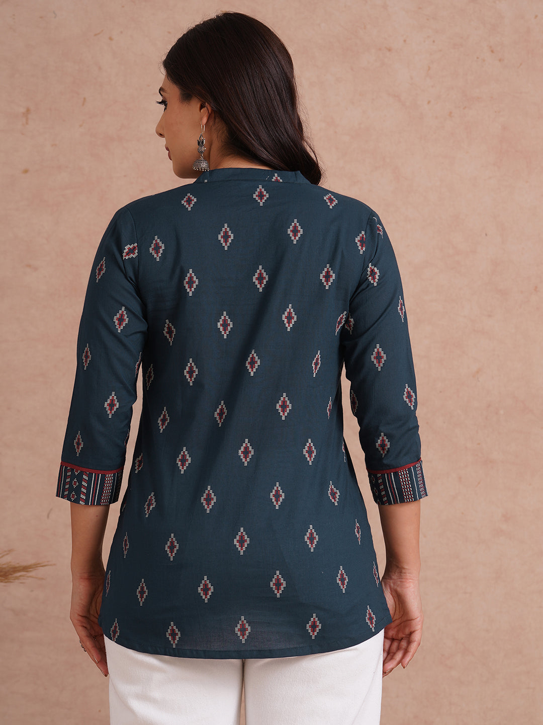 Printed short top with contrast fabric detailing with metal accessories.