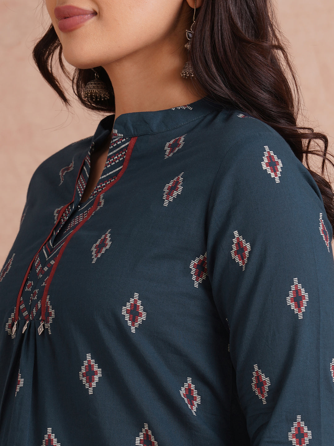 Printed short top with contrast fabric detailing with metal accessories.