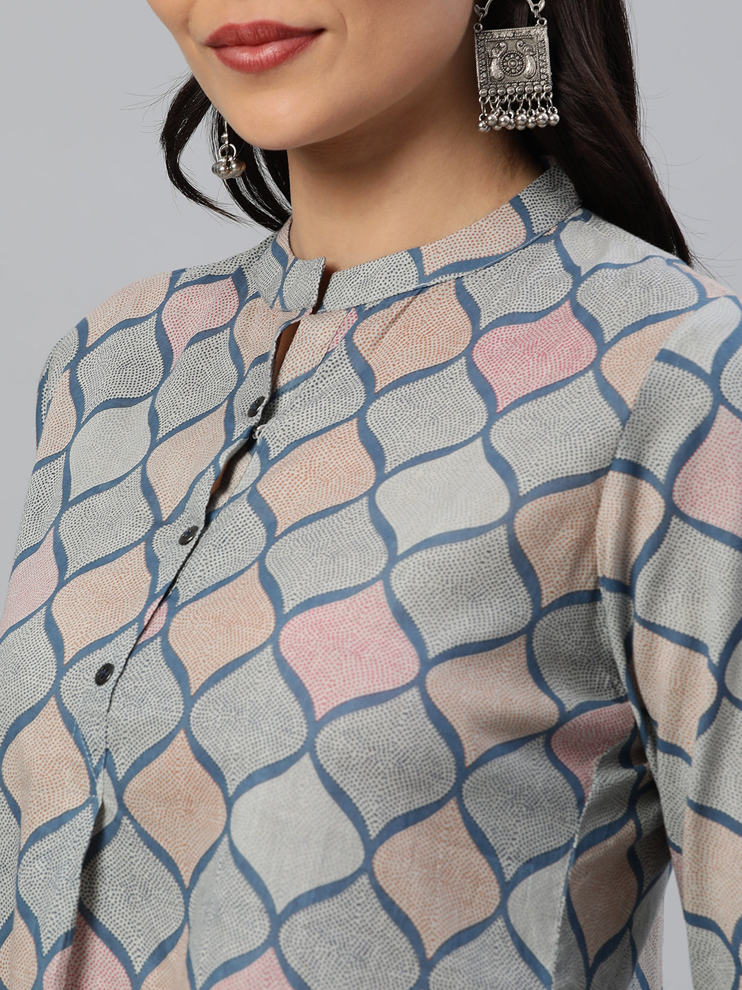 Flared printed cotton top with stand collar, knife pleat and button detailing