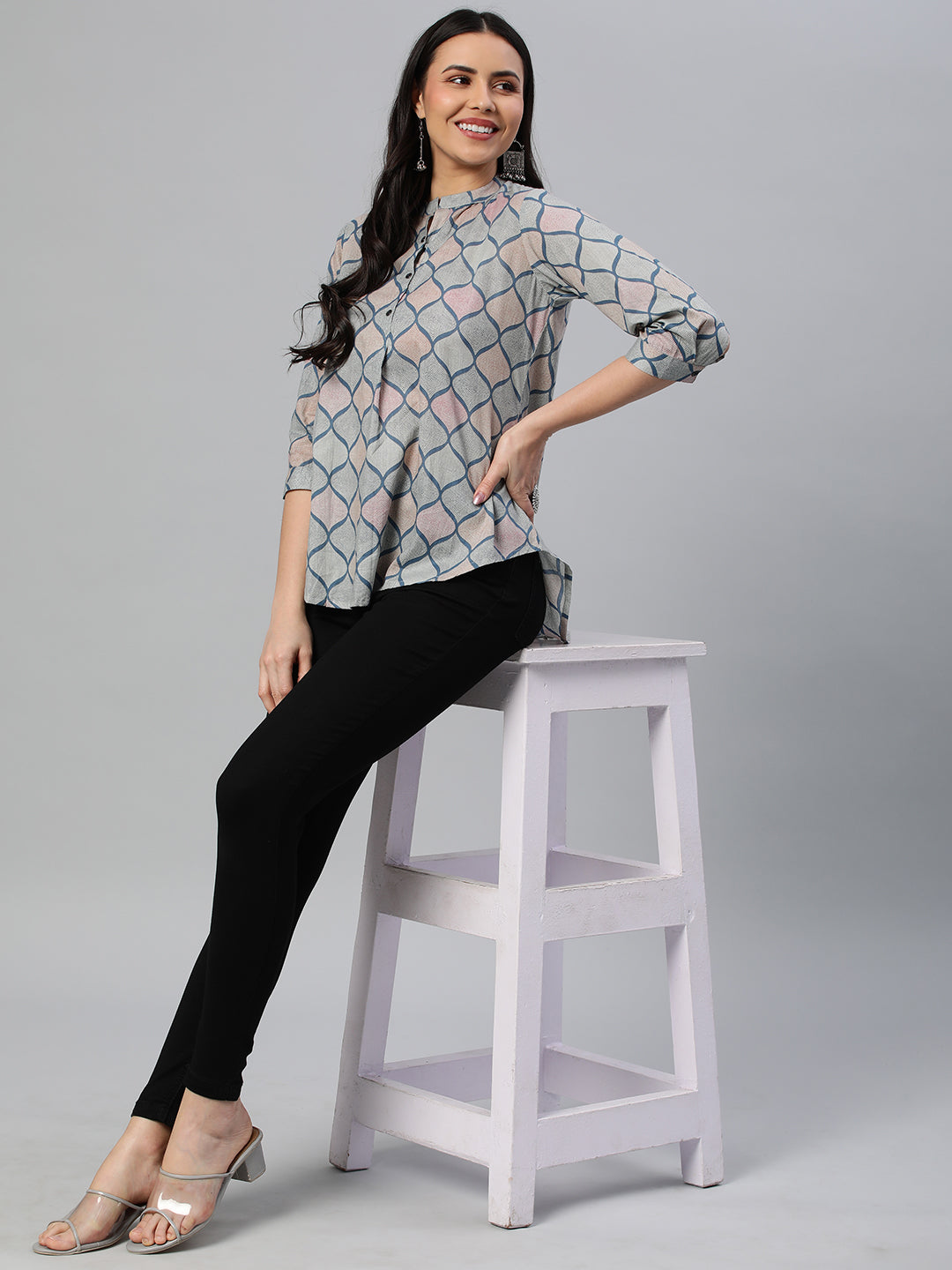 Flared printed cotton top with stand collar, knife pleat and button detailing