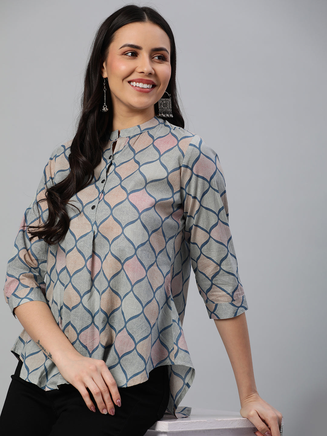 Flared printed cotton top with stand collar, knife pleat and button detailing