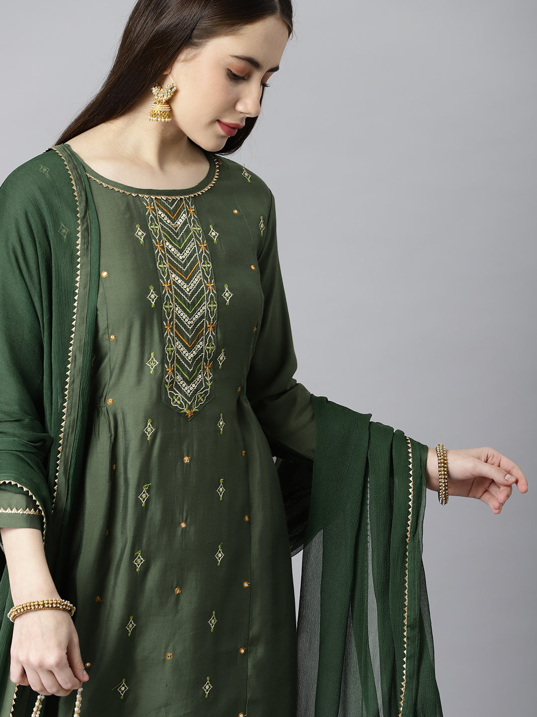 Party Edit- A line silk blend kurta with embroidered neck paired with dupatta and self tone bottom