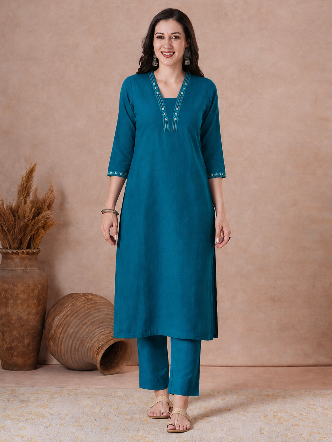 Straight Fit Cotton Kurta with Geometric Machine Embroidery on V-Neck and Sleeves.