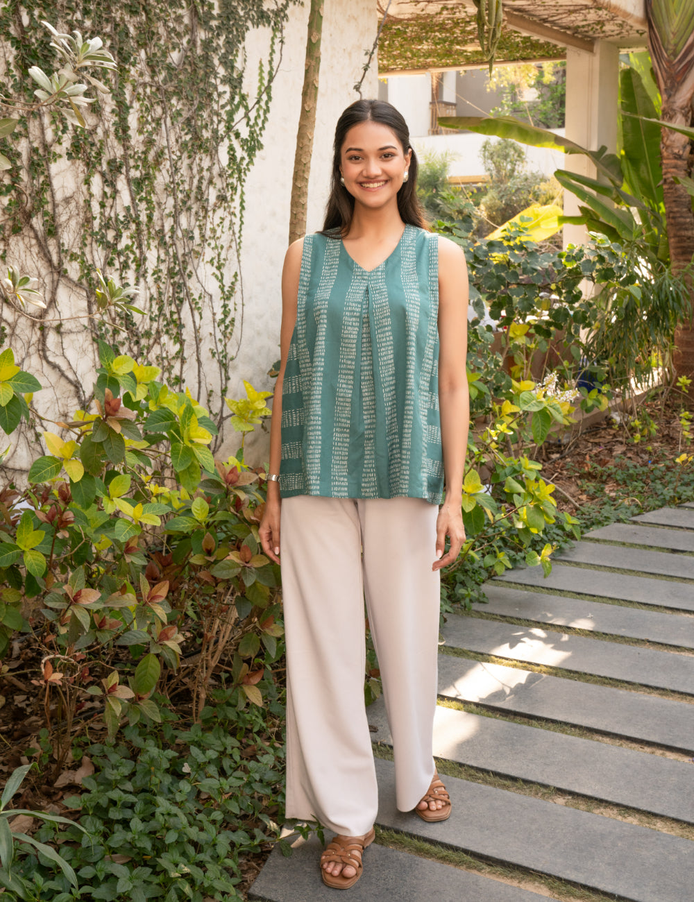 Printed flex sleeveless top with center pleat and elasticated gathers.