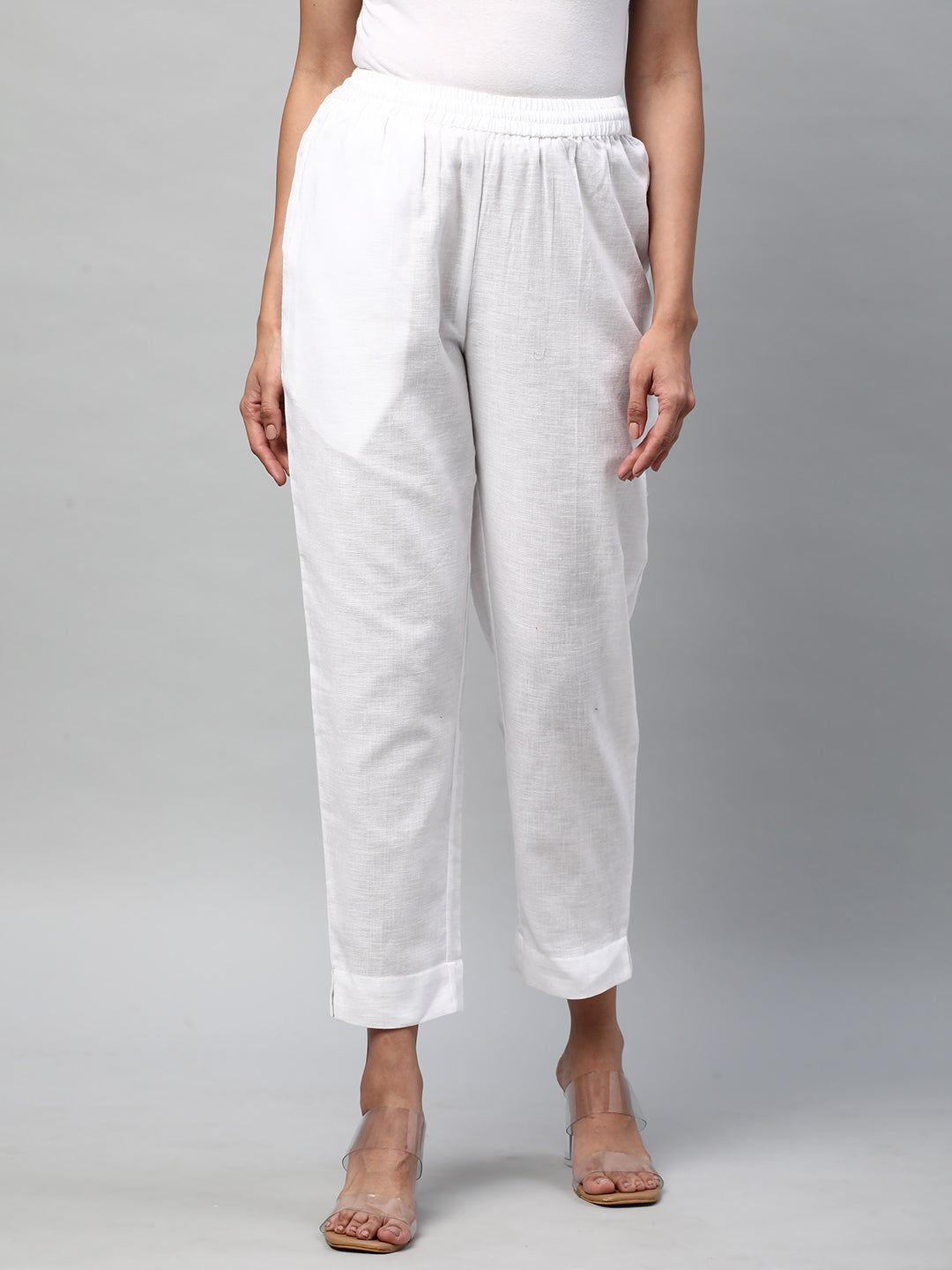 A fully elasticated white ankle length cotton linen pant