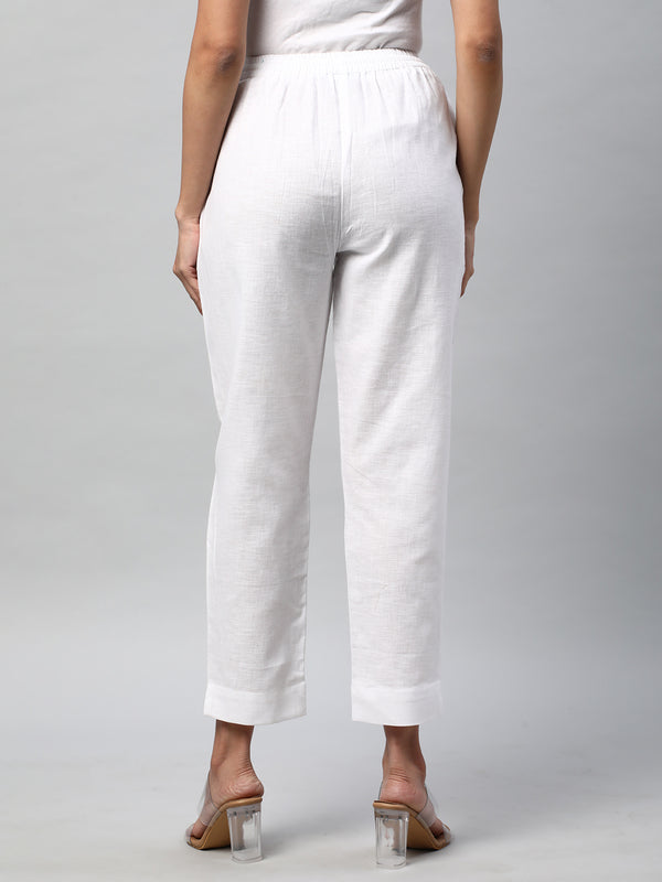 A fully elasticated white ankle length cotton linen pant