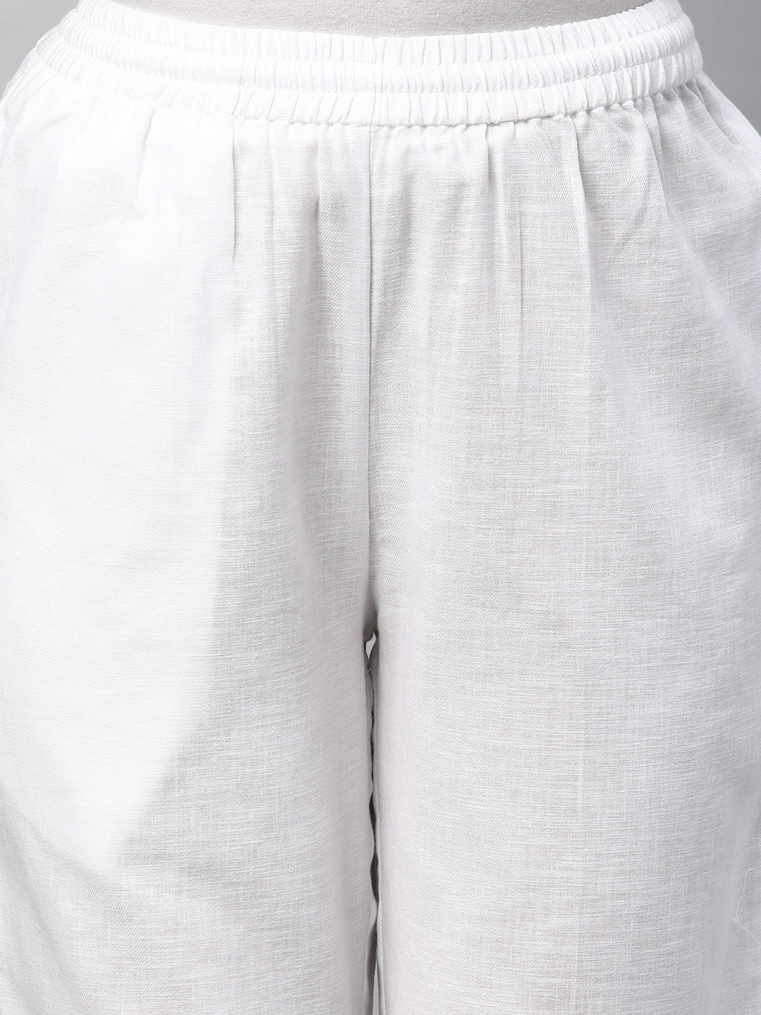 A fully elasticated white ankle length cotton linen pant