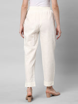 A fully elasticated off-white ankle length cotton linen pant.