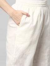 A fully elasticated off-white ankle length cotton linen pant.