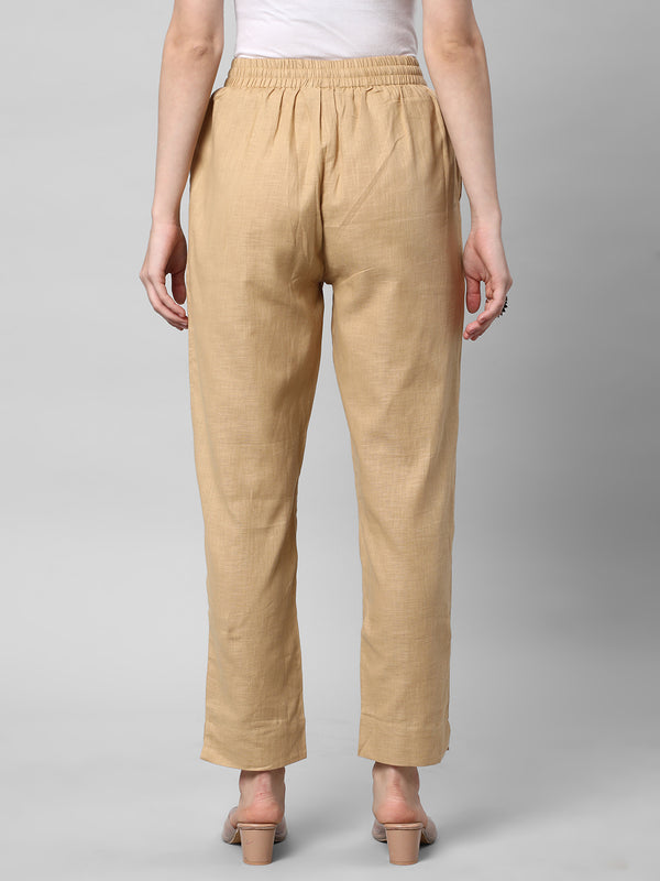 A fully elasticated beige ankle length cotton linen pant.