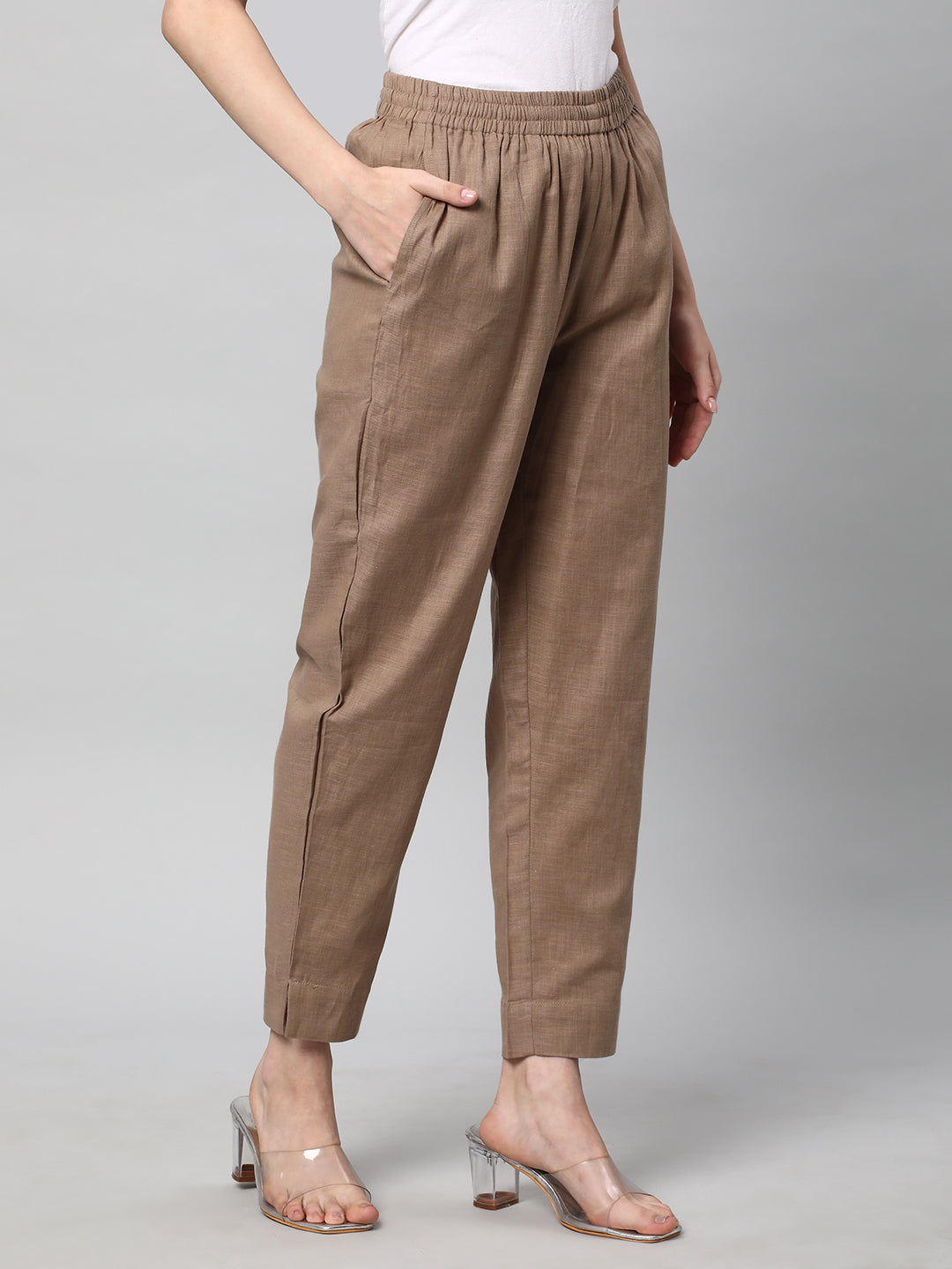 A fully elasticated brown ankle length cotton linen pant