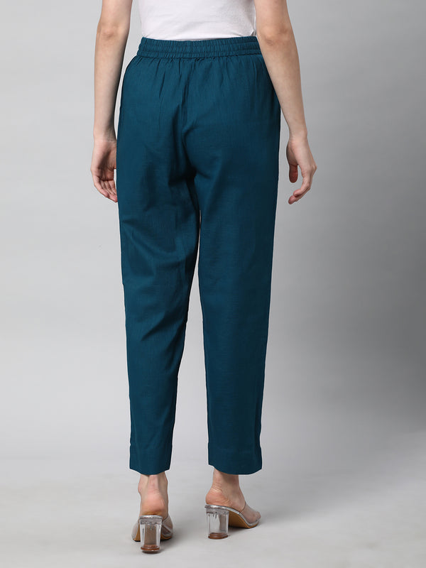 A fully elasticated teal ankle length cotton linen pant.
