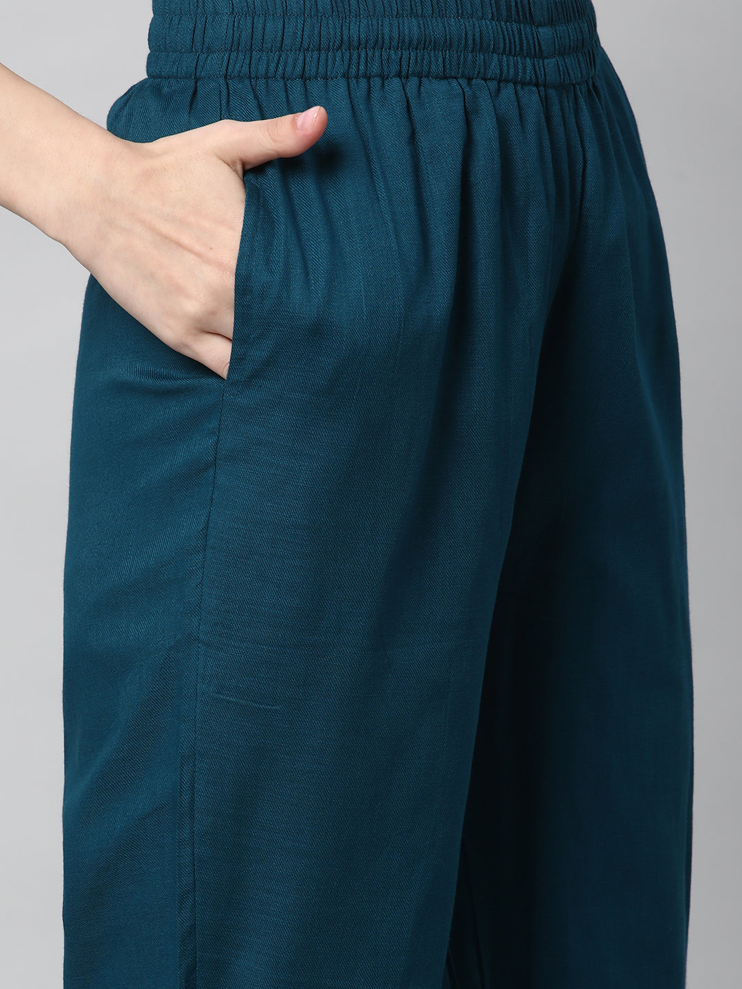A fully elasticated teal ankle length cotton linen pant