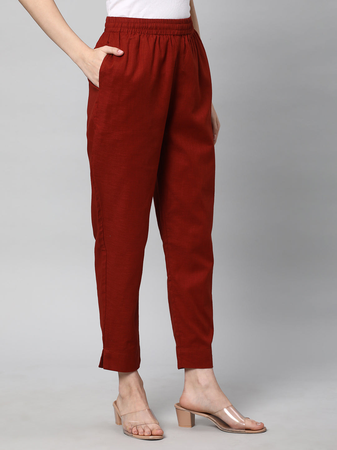 A fully elasticated rust ankle length cotton linen pant