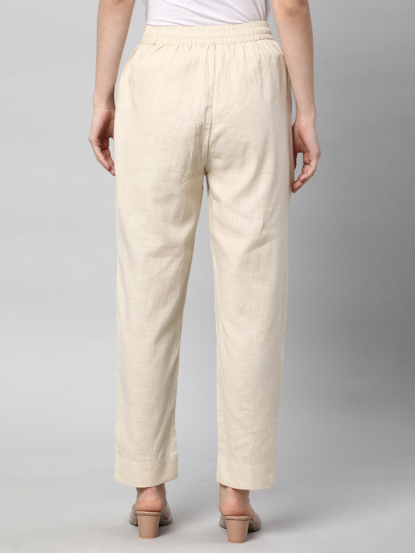 A fully elasticated cream ankle length cotton linen pant.