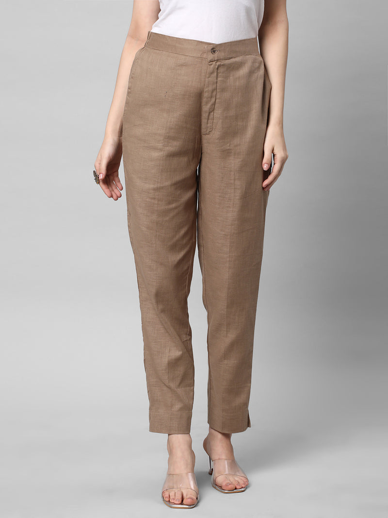 A brown ankle length cotton linen pant with plain belt in front.