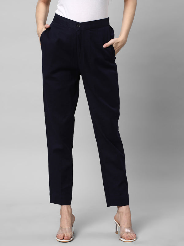 A Navy ankle length cotton linen pant with plain belt in front.