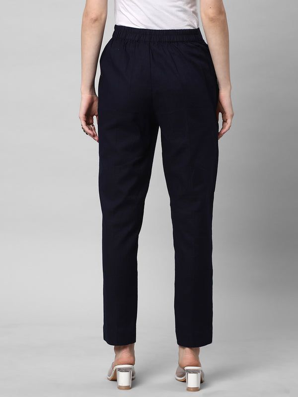 A Navy ankle length cotton linen pant with plain belt in front.