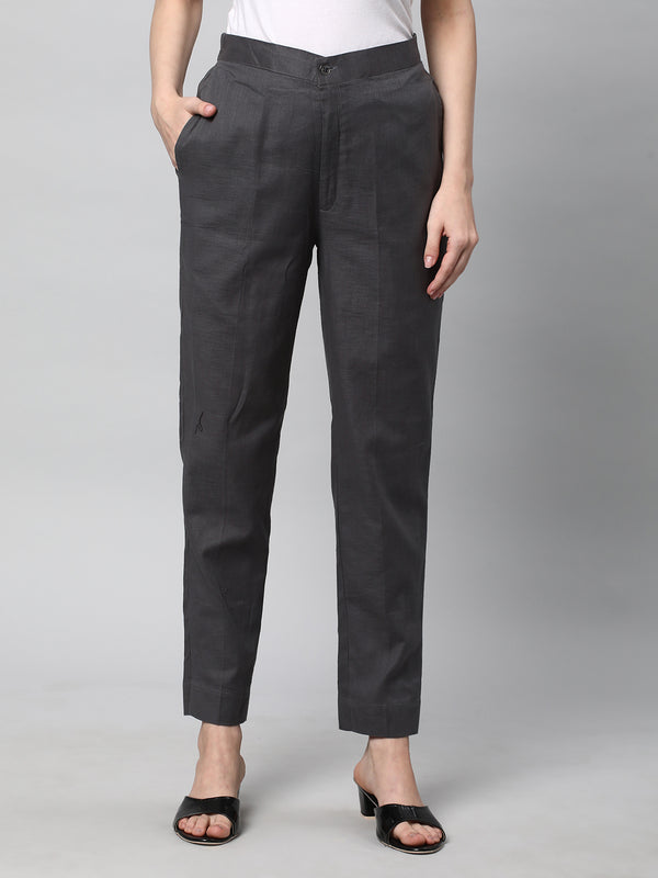 A Grey ankle length cotton linen pant with plain belt in front.