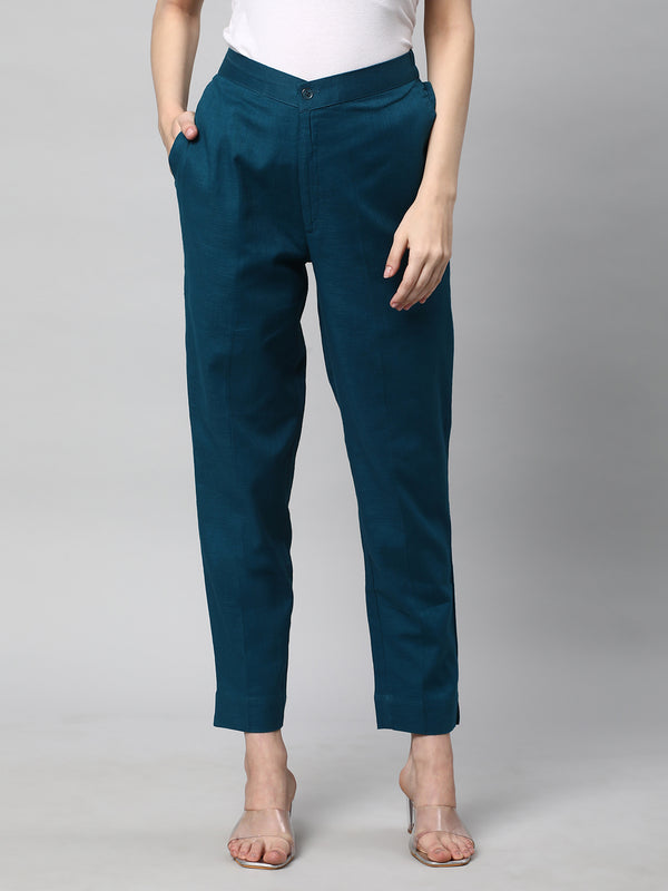 A Teal ankle length cotton linen pant with plain belt in front.