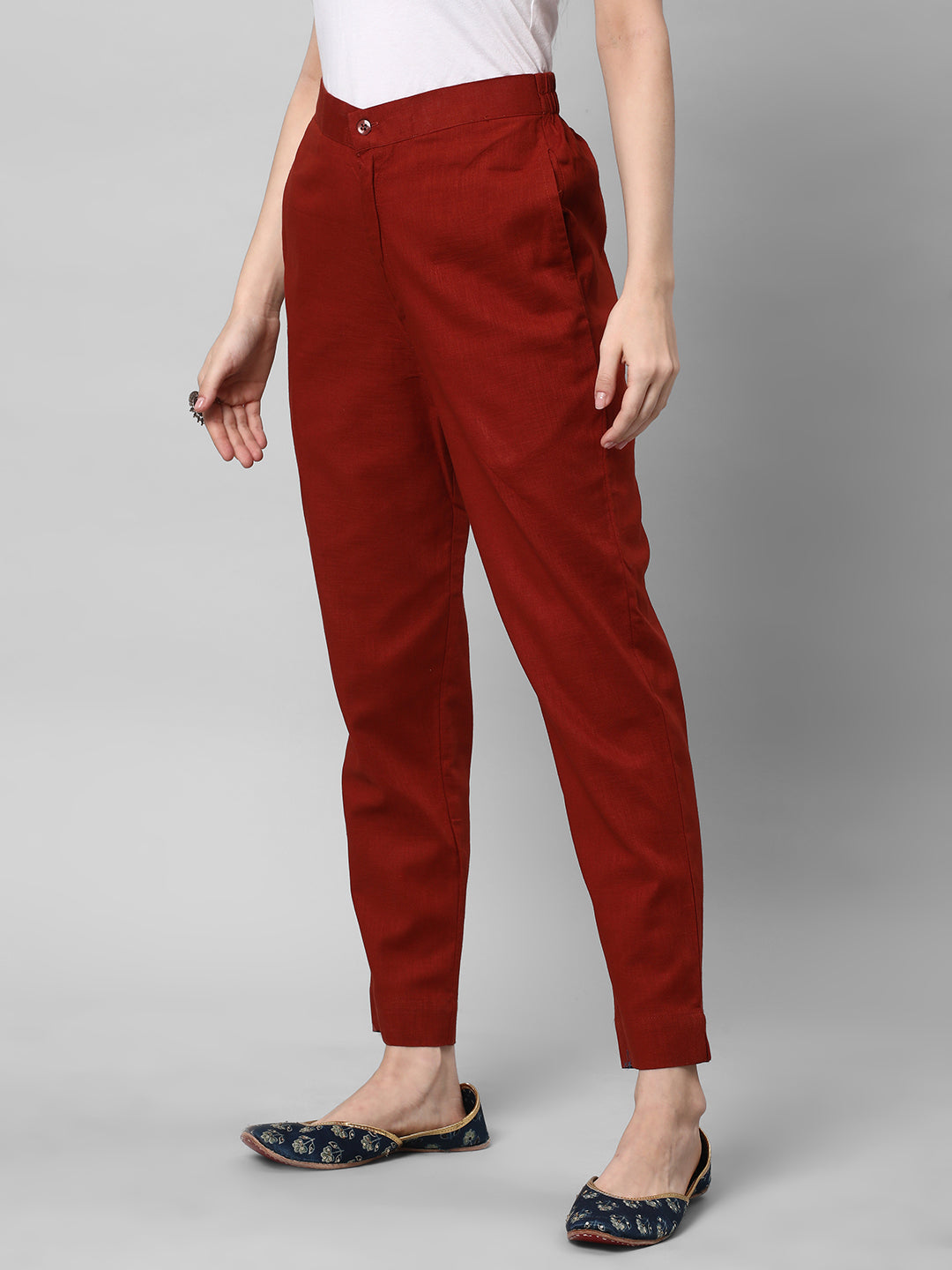 A Rust ankle length cotton linen pant with plain belt in front