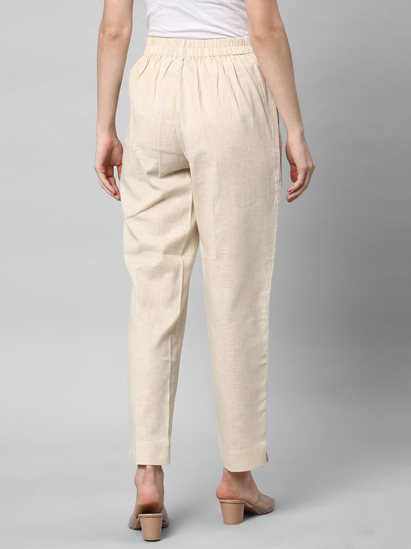 A Cream ankle length cotton linen pant with plain belt in front.