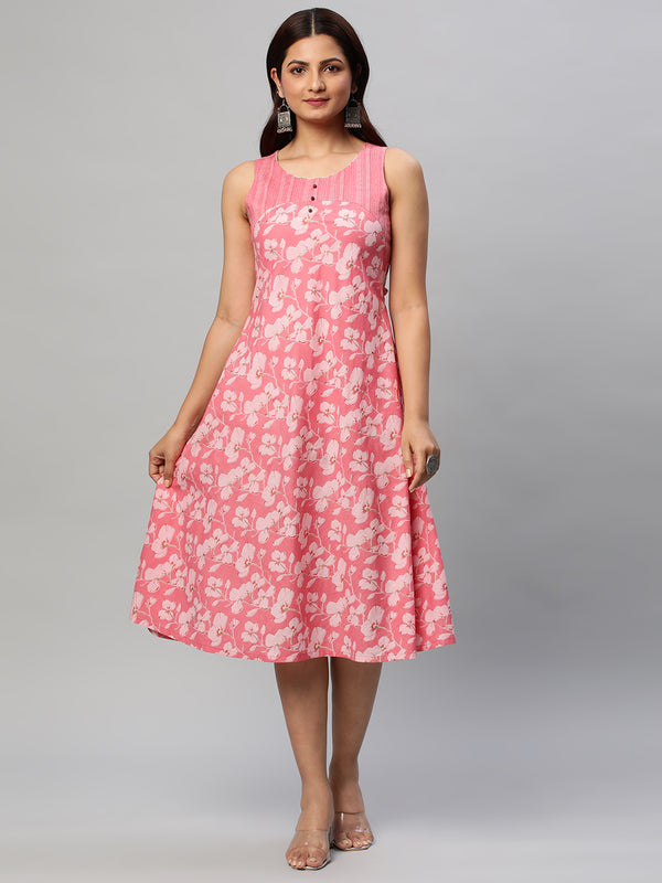 Flared cotton printed sleeveless dress with yoke and button deailing.