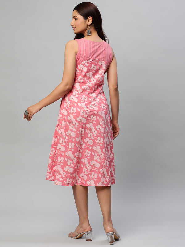 Flared cotton printed sleeveless dress with yoke and button deailing.