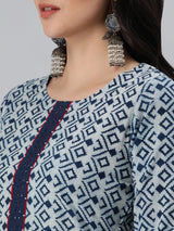 Straight fit indigo print kurta with detailing of schiffli on placket and sleeves.