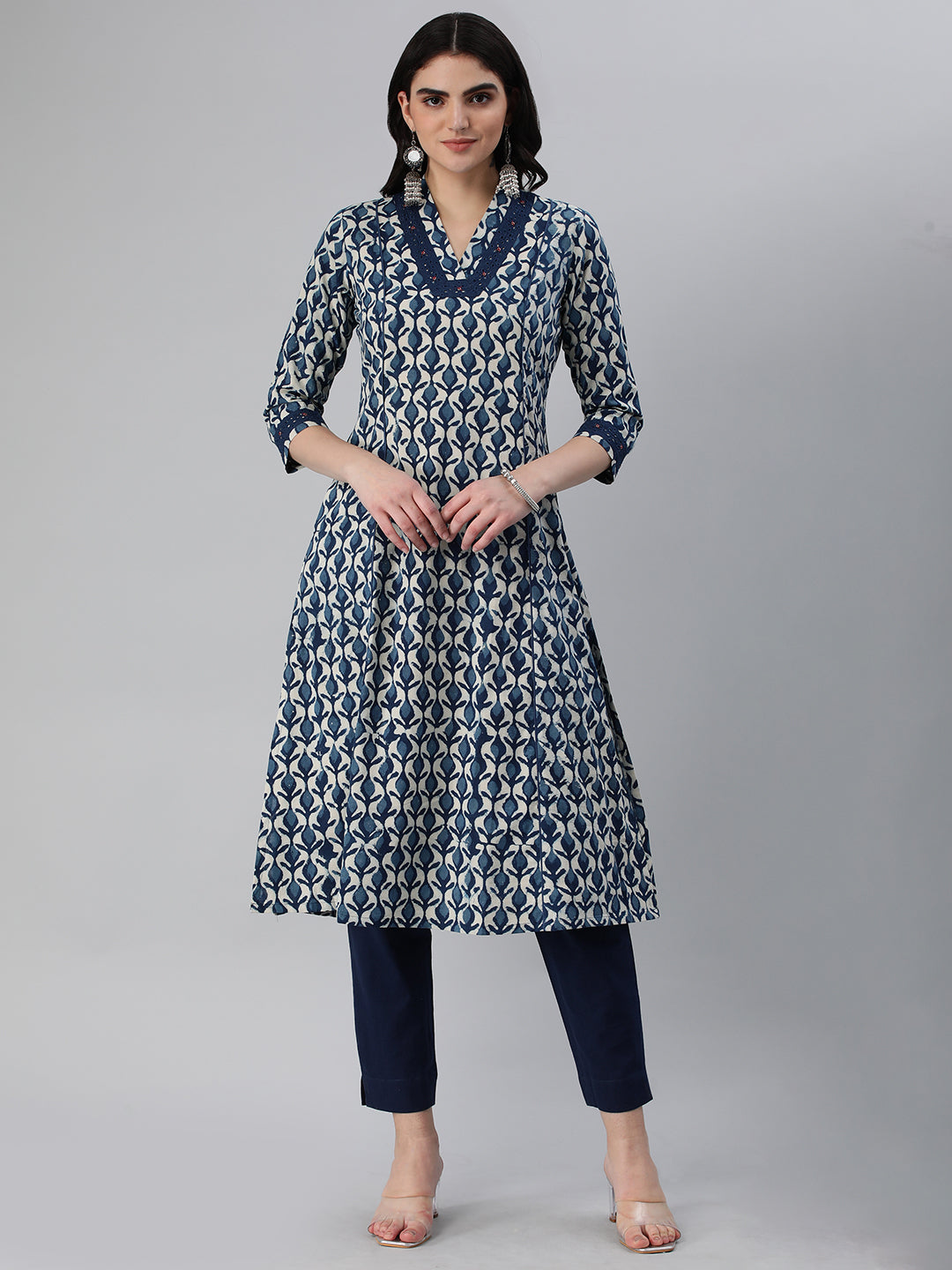 A flared bagru printed kurta with schifli detailing on V neck and cuff