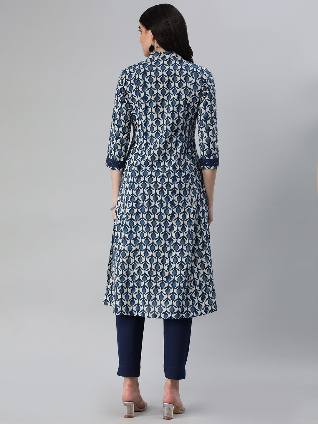 A flared bagru printed kurta with schifli detailing on V neck and cuff