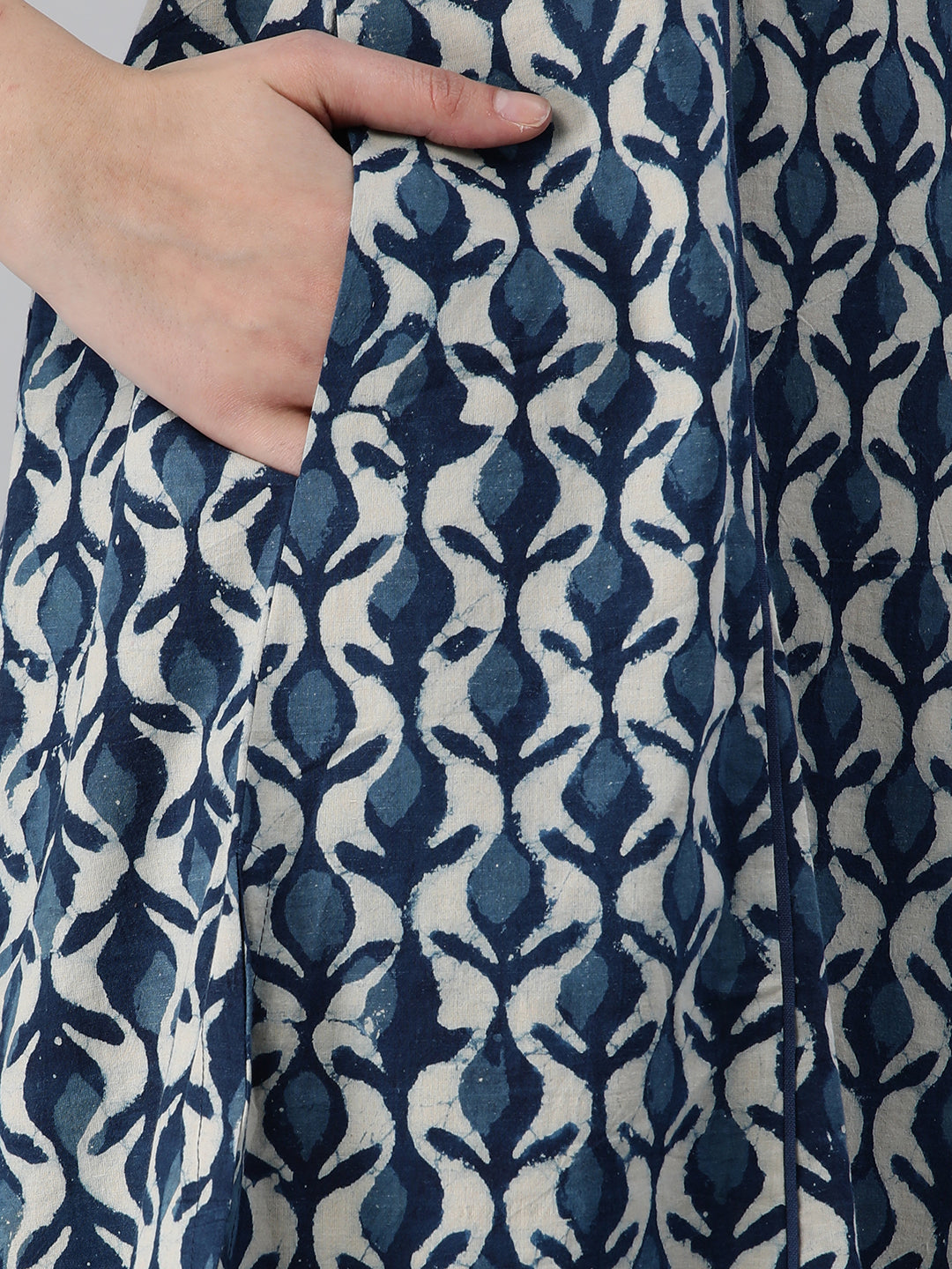 A flared bagru printed kurta with schifli detailing on V neck and cuff