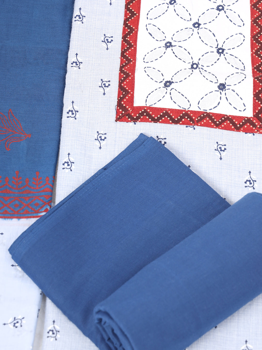 Unstitched printed suit set with a contrast colour applique yoke that emphasizes handwork and printed dupatta