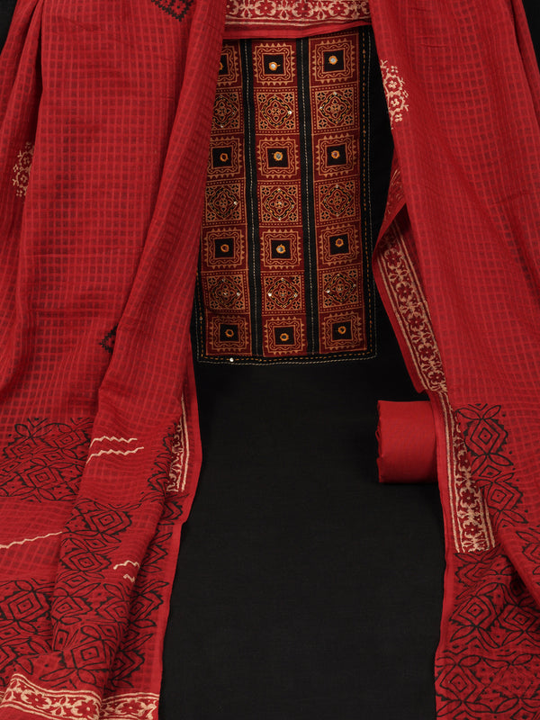 Black unstitched suit set with a mix-and-match yoke and handwork details with printed dupatta and plain bottom