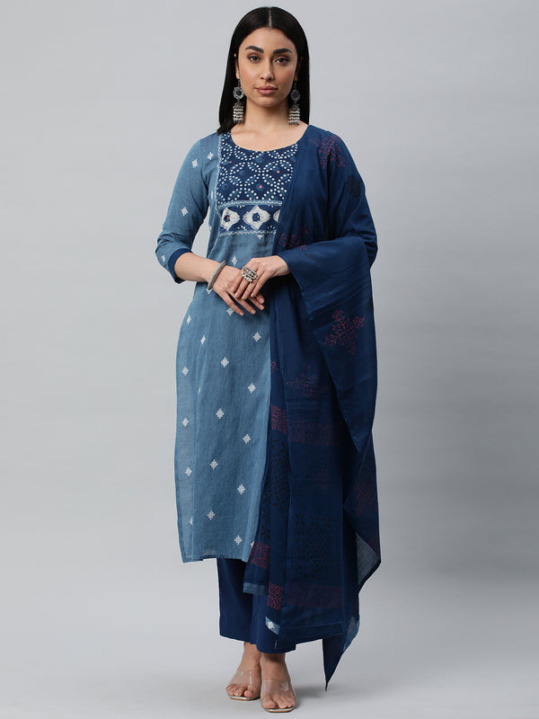 Unstitched dobby suit set with a self-darkened mul dupatta and dabu patch yoke with hand work.