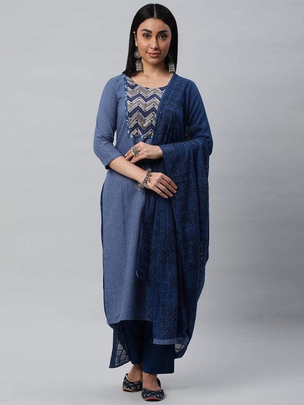 Unstitched dobby suit set with a self-darkened mul dupatta and dabu patch yoke with embroidery.